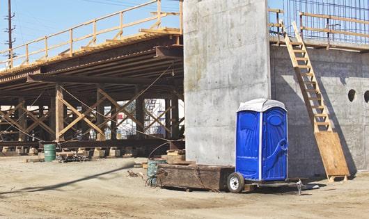 easily accessible porta potties at a construction site, saving workers from long walks to a permanent restroom